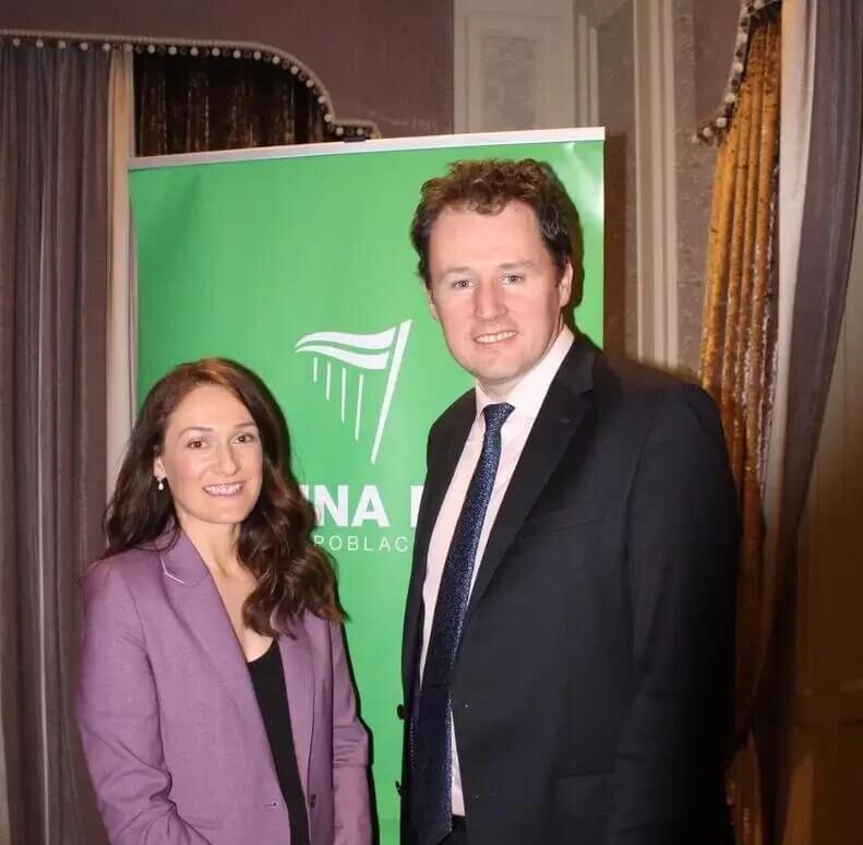 Picture of Senator Erin McGreehan in a purple suit blazer and trousers and a black top standing beside Minister for Agriculture Charlie McConalogue who is wearing a black blazer, white shirt and a dark blue patterned tie.