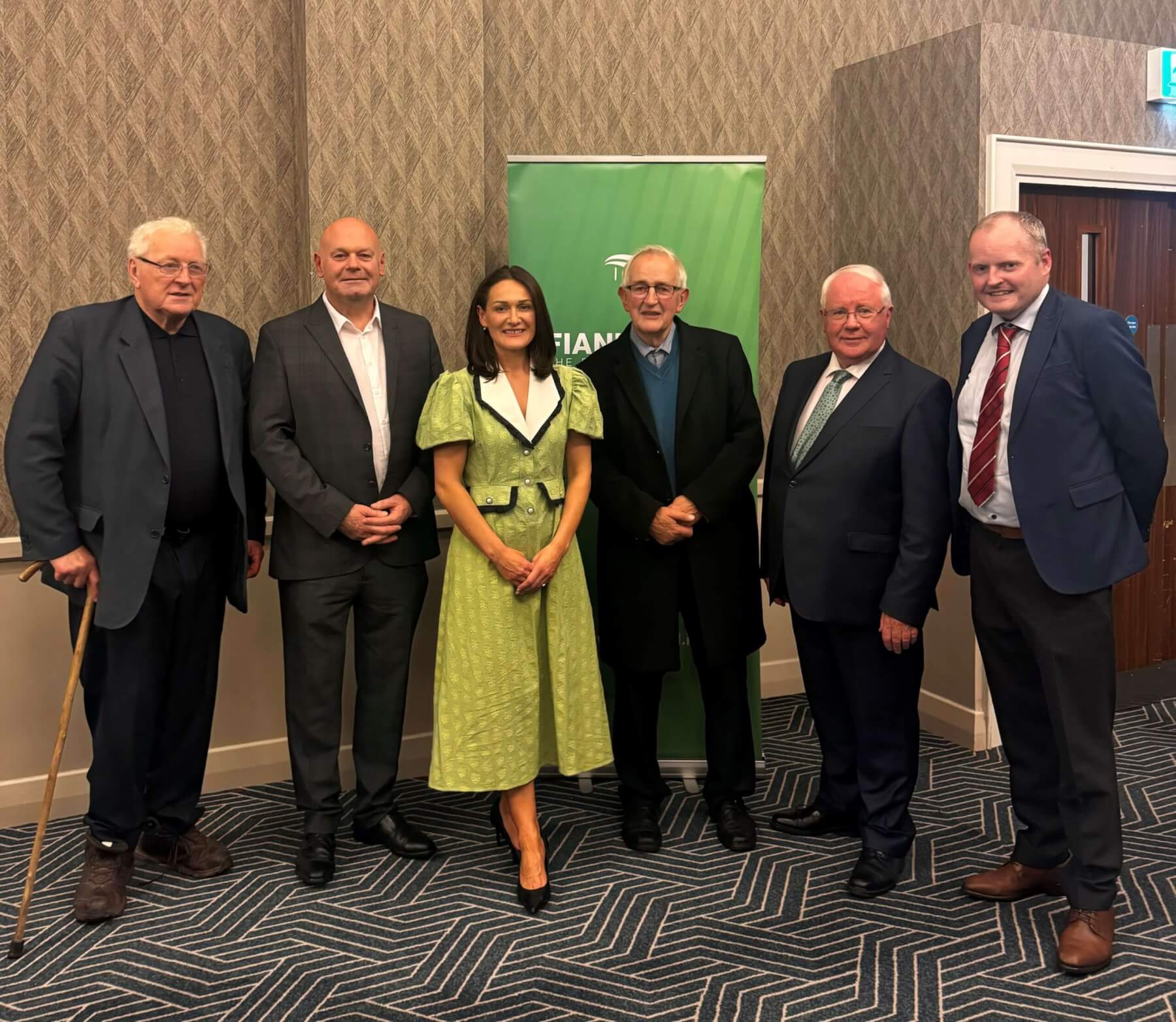 Picture (L to R) Seamus Kirk, Senator Diarmuid Wilson, Senator Erin McGreehan, Peter Savage, Brendan Smith TD, Conor Keelan. The men are wearing dark suits and ties and white shirts. Erin is wearing a green dress.