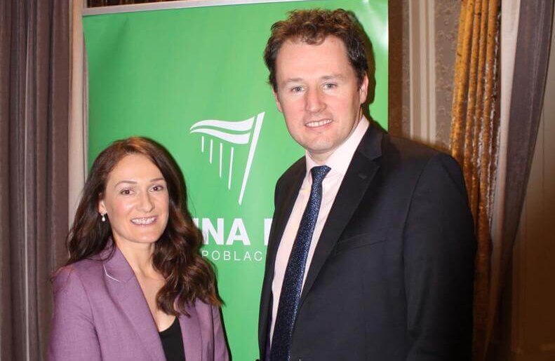 Picture of Senator Erin McGreehan in a purple suit blazer and trousers and a black top standing beside Minister for Agriculture Charlie McConalogue who is wearing a black blazer, white shirt and a dark blue patterned tie.